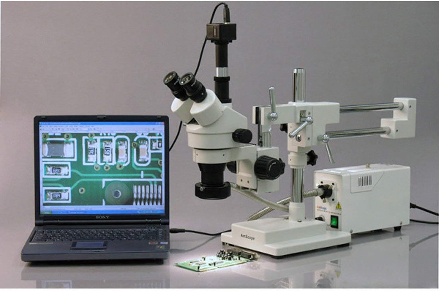 AmScope SM-4TPZ Professional Trinocular Stereo Zoom Microscope with Simultaneous Focus Control, WH10x Eyepieces, 3.5X-90X Magnification, 0.7X-4.5X Zoom Objective, Ambient Lighting, Double-Arm Boom Stand, Includes 0.5X and 2.0X Barlow Lens